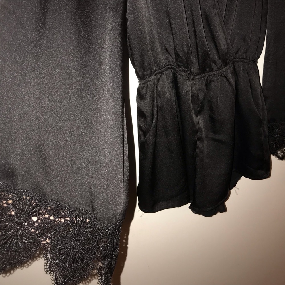 STELLA black romper with lace accent